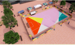 A computer illustration of a colourful football pitch, laid out on a concreted area like a town square. The pitch is surrounded by banners and pop up tents, and some trees.